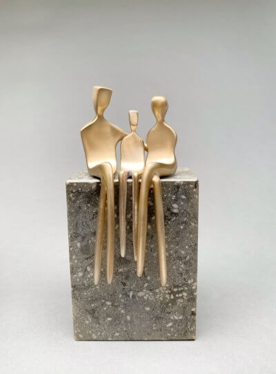 family of three in brushed bronze