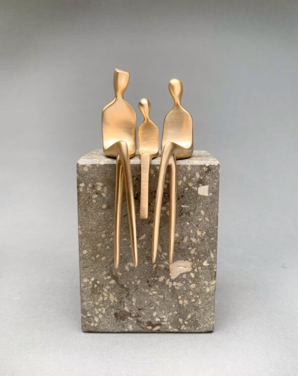 family of three in brushed bronze
