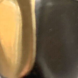 Black patina and polished bronze finish