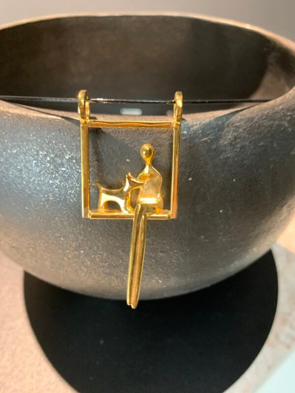 woman with dog pendant