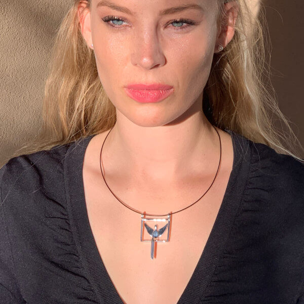 Model wearing Angel pendant in silver