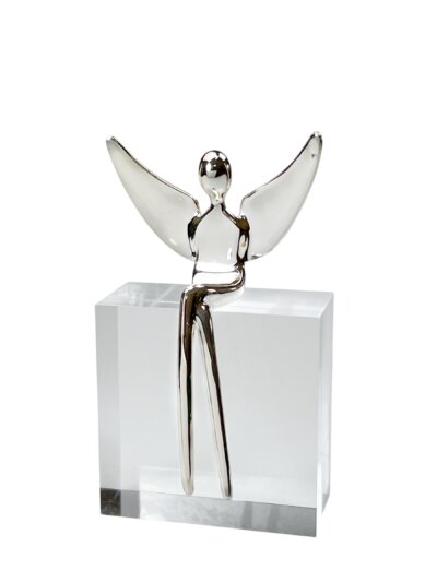 Silver angel figurine on acrylic block