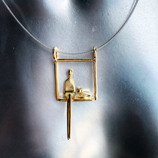 woman with cat in gold pendant front