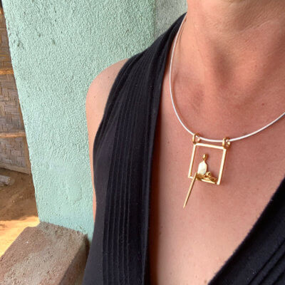 woman with cat pendant gold y