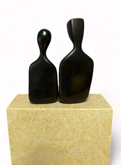 backside of The two of us - bronze anniversary, 8th year solid bronze sculpture of a seated couple by Yenny Cocq