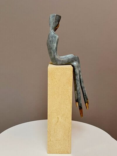 gray figurative sculpture, side