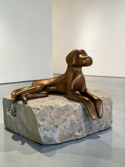 Lying down dog sculpture in 4.25"