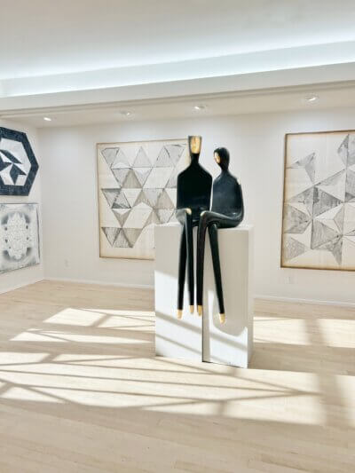 Large bronze sculpture of lovers, romantic outdoor sculpture.