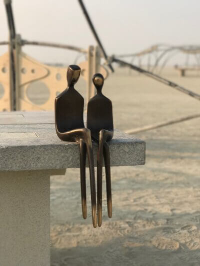 The Two of Us by Yenny Cocq, bronze sculpture at Burningman