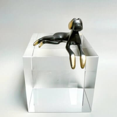 lying down dog sculpture