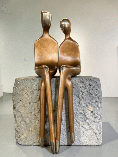Bronze sculpture, elongated forms and minimalist facial features