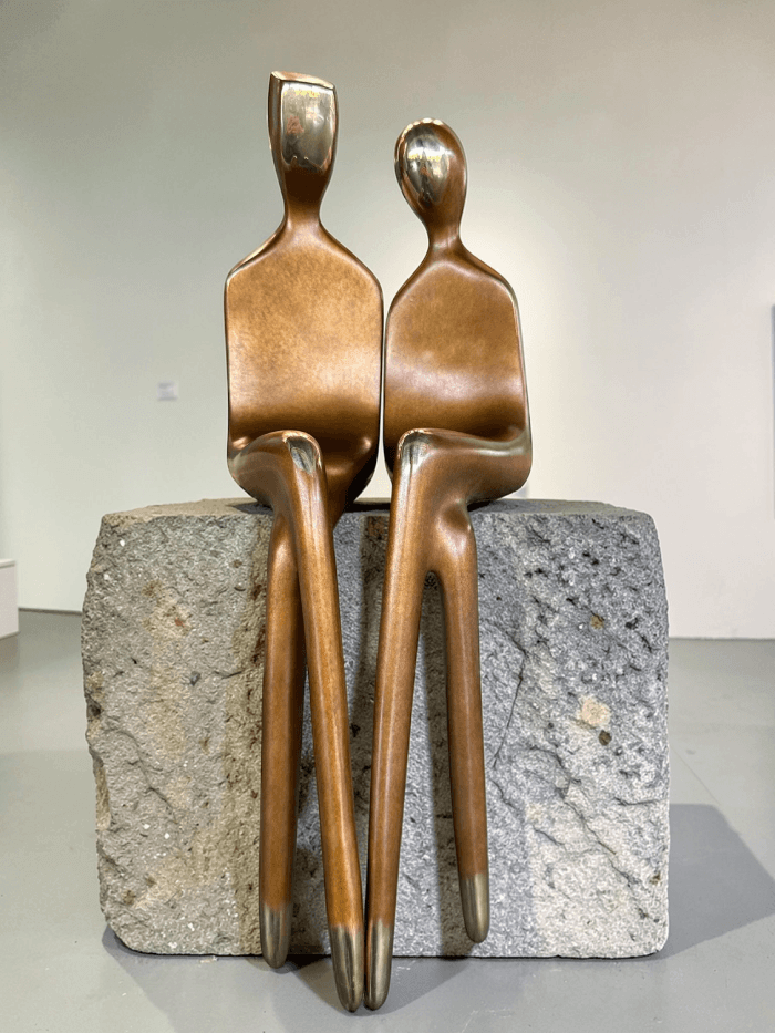 Bronze sculpture, elongated forms and minimalist facial features